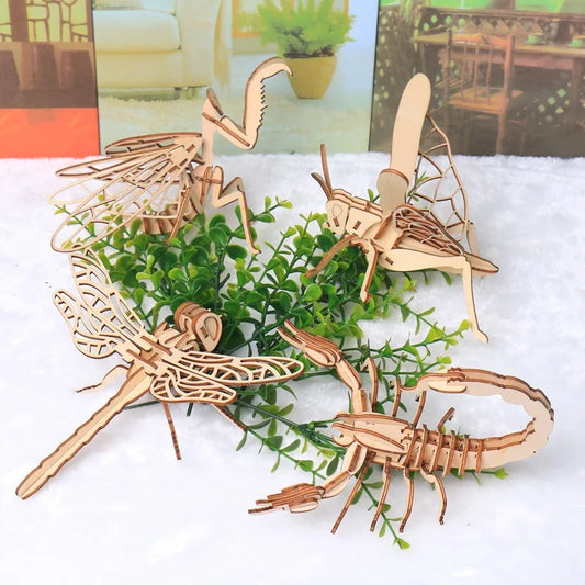 Wooden insect model with long antennae, segmented body, and lattice wings