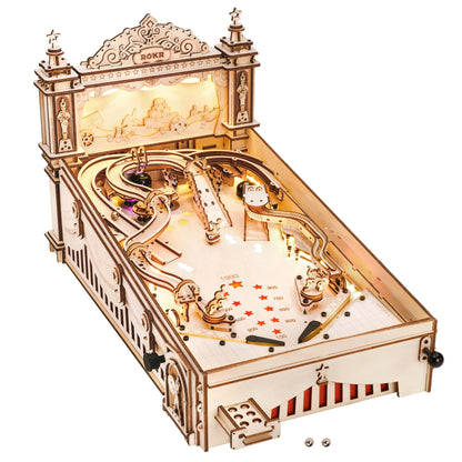 Wooden pinball machine with decorative top frame, curved tracks, and ball launch