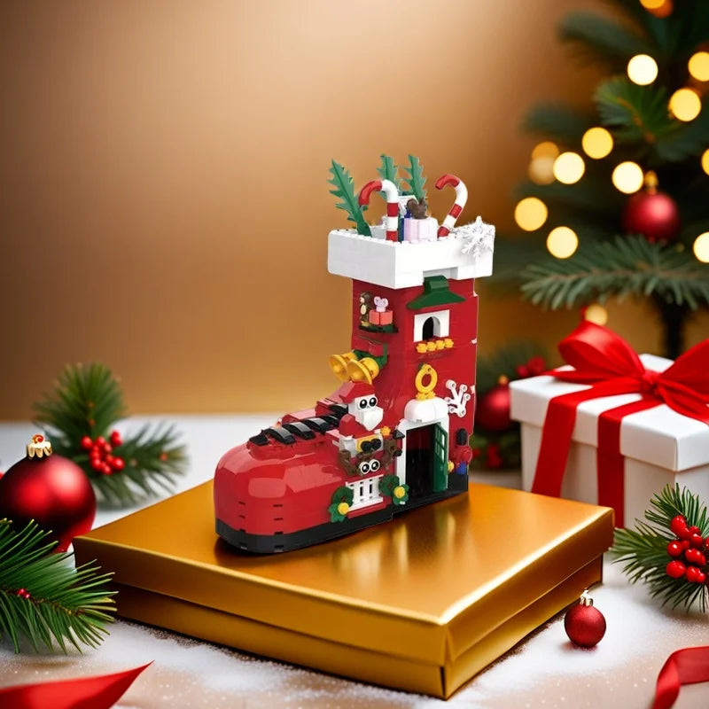 Red boot building set on gold box, decorated with nutcracker and greenery