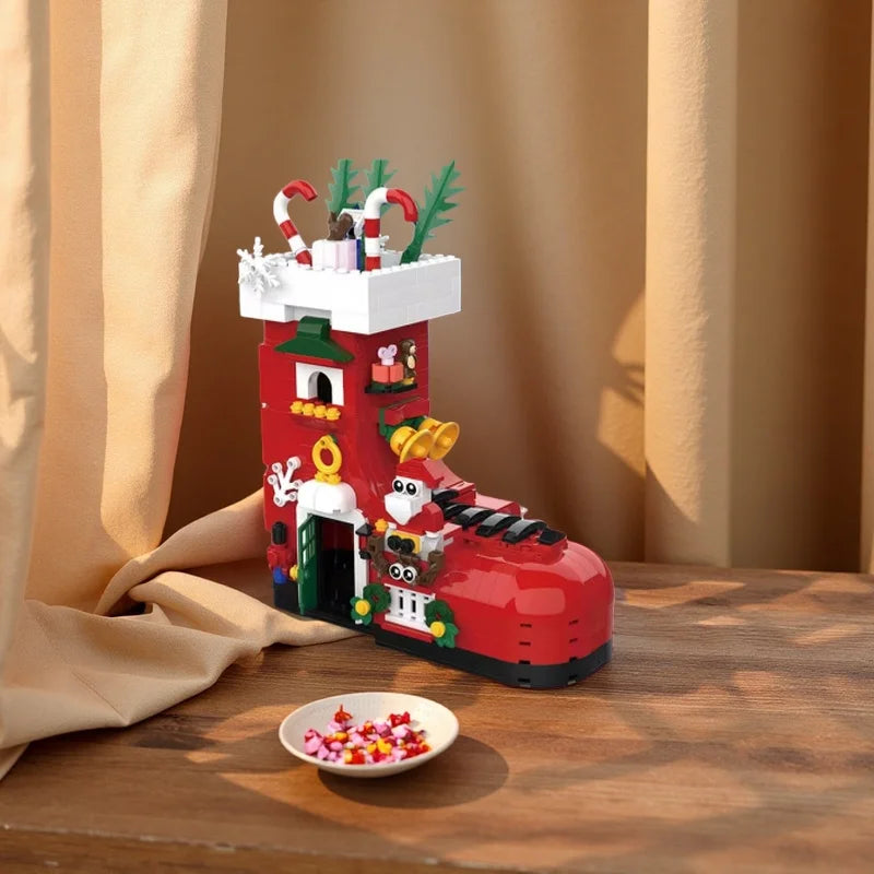 Red boot-shaped building set with nutcracker figures and candy-cane accessories