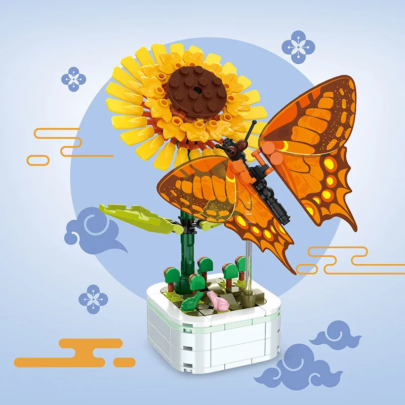 Orange butterfly building set with green stem and yellow flower on white block base