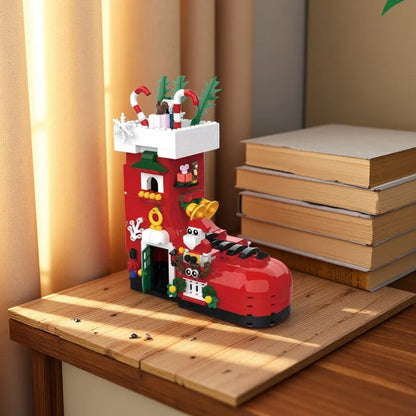 Red boot-shaped building set on wooden board with small nutcracker characters