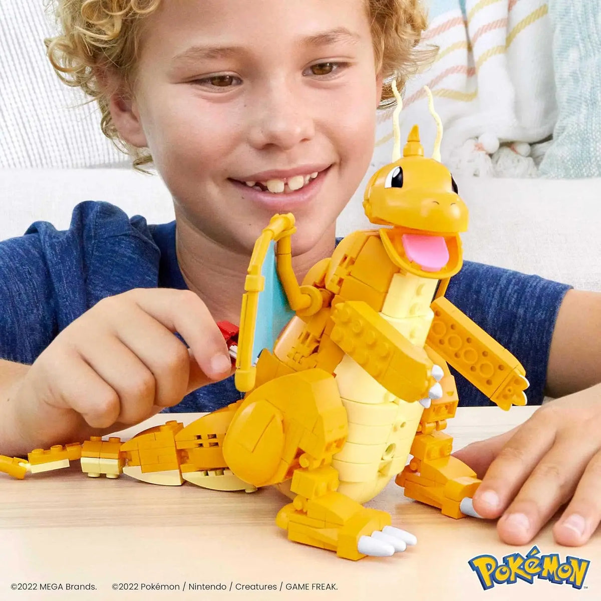 Dragonite building set figure with articulated wings and tail, shown assembled