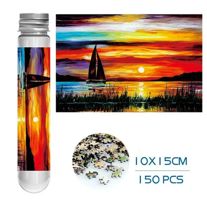 Mini puzzle tube set with colorful sunset over sailboats and 150-piece jigsaw preview