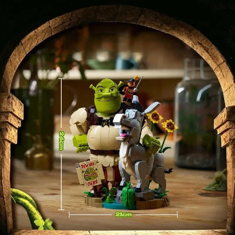 Brick build figurines in arch frame: green ogre riding white donkey on round base