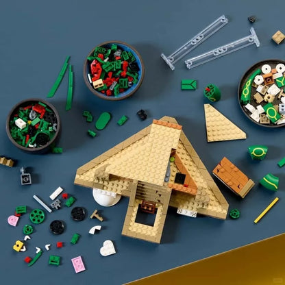 Tan brick build with A-frame house, green base pieces, and accessories