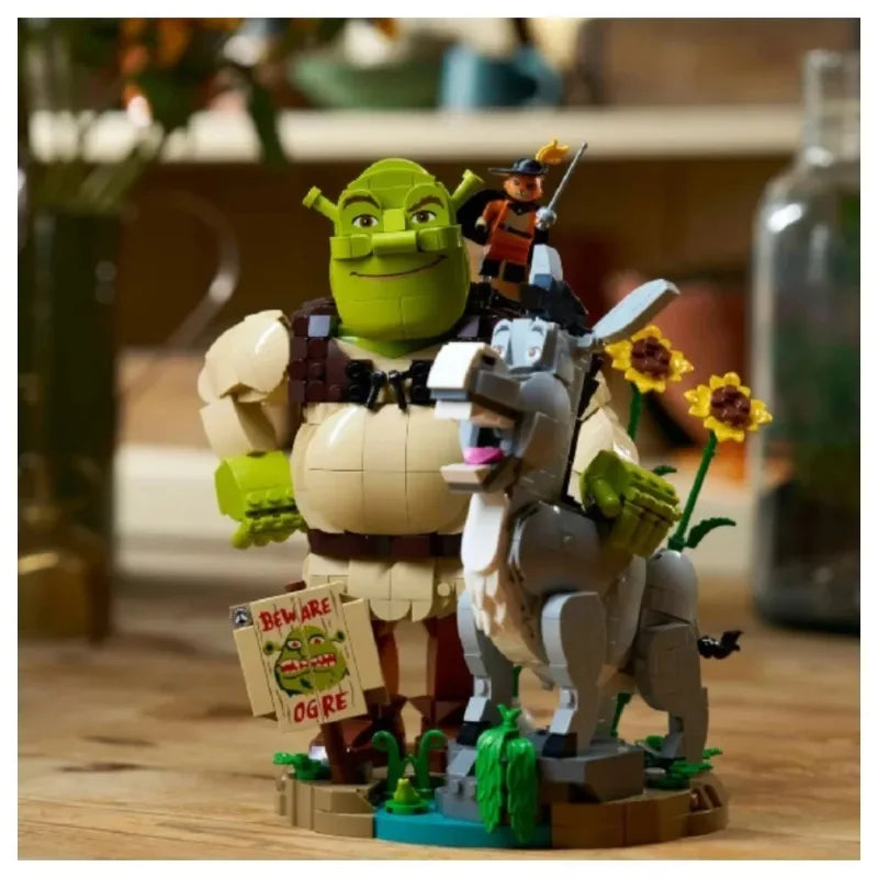 Brick build figurines: green ogre and white donkey with small rider, holding flowers