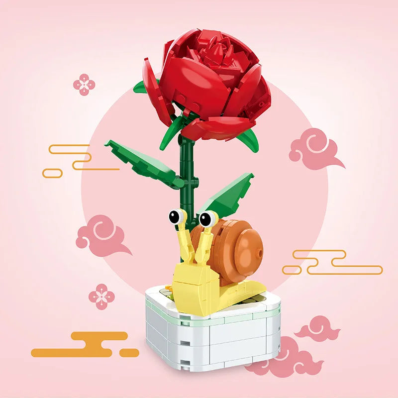 Red rose and ladybug building set on white block base