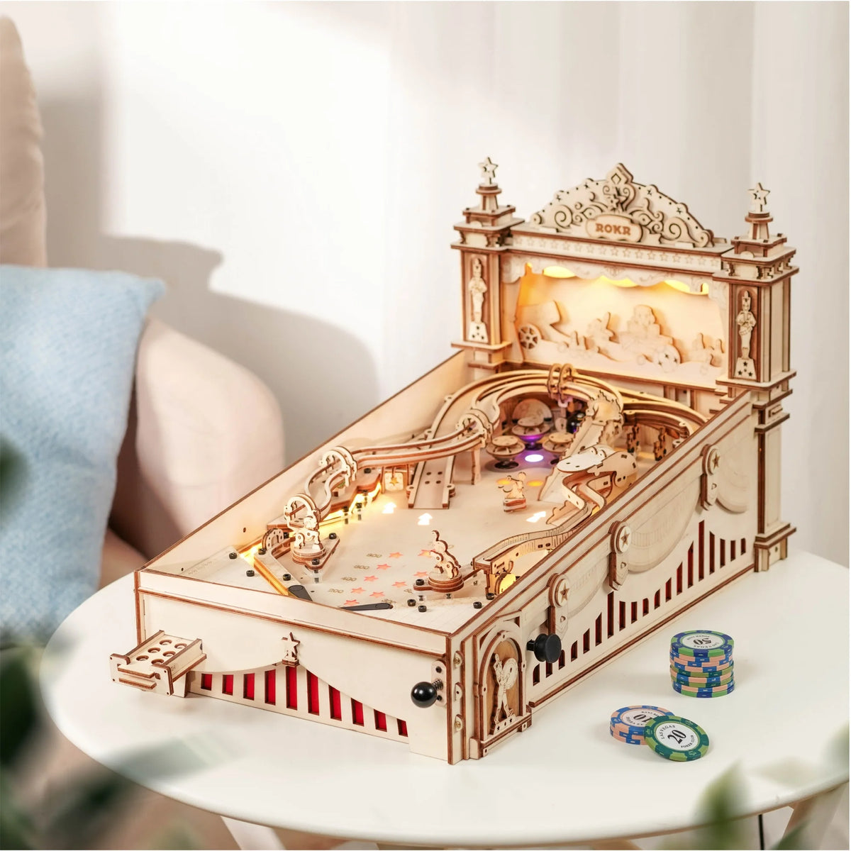 Wooden pinball machine with lit wooden playfield, ramps, and scoring lanes
