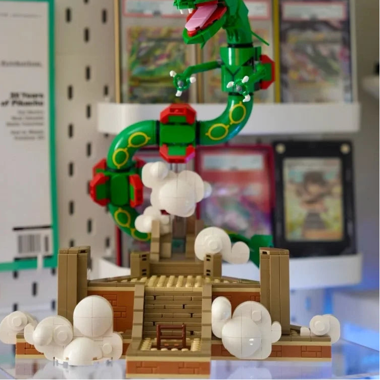 Buildable dragon figure with green body, red armor, and white cloud pieces on a base
