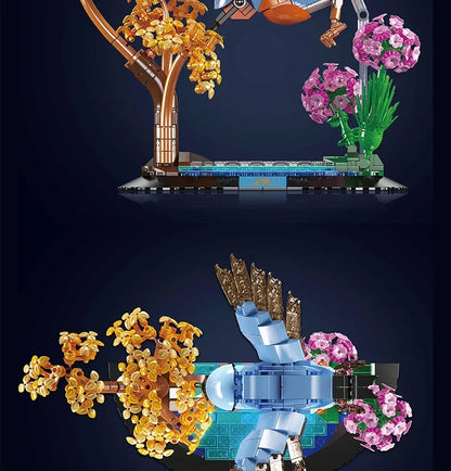 Brick bird sculpture side view with golden branches, pink flowers, and blue platform