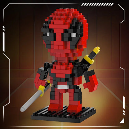 Mini brick hero figure in red and black holding a yellow sword piece on black base
