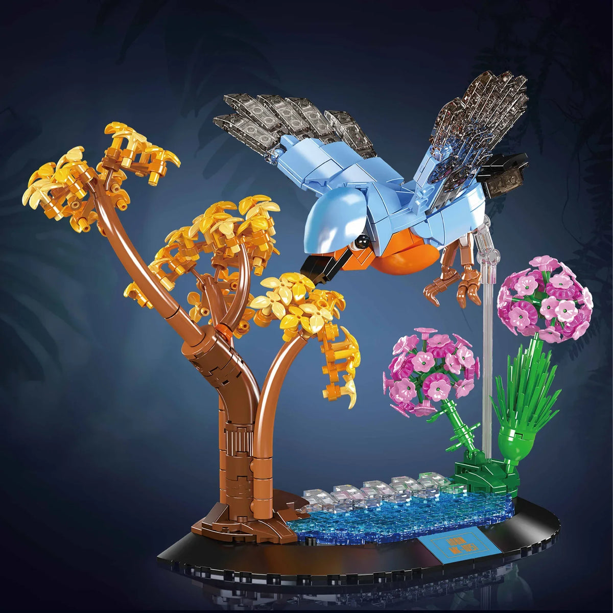 Blue and gold brick bird sculpture with flower clusters on a branching tree stand