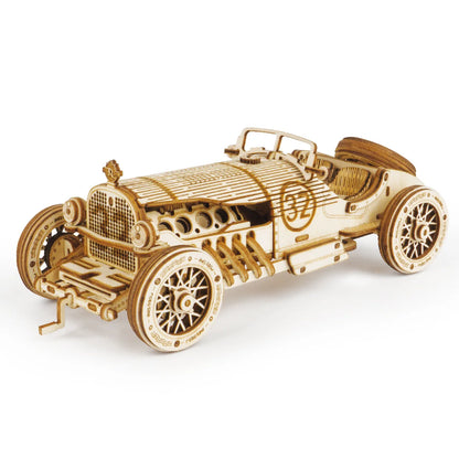 Wooden Grand Prix race car model with detailed grille and spoked wheels.