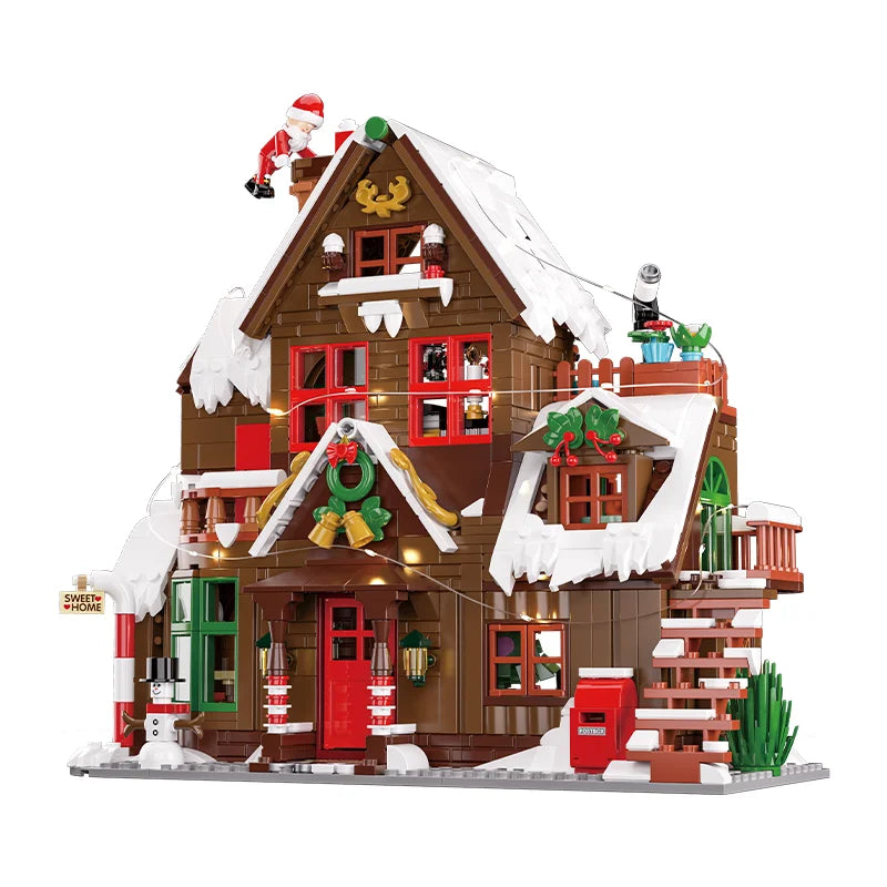 Christmas chalet building set with Santa figure, glowing lights, and decorated front entrance