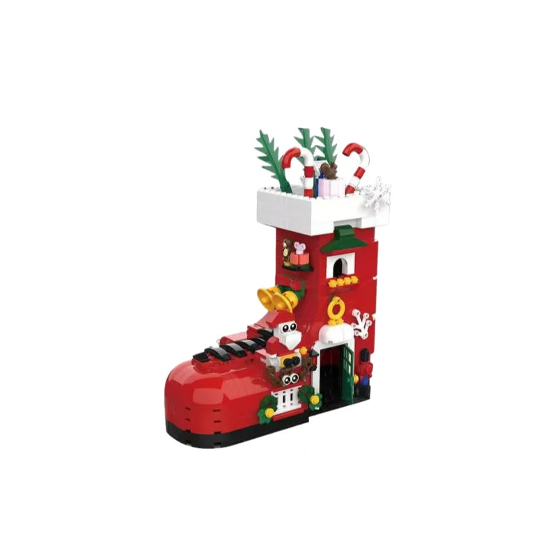 Red boot-shaped building set with white top, candy canes, and nutcracker figures
