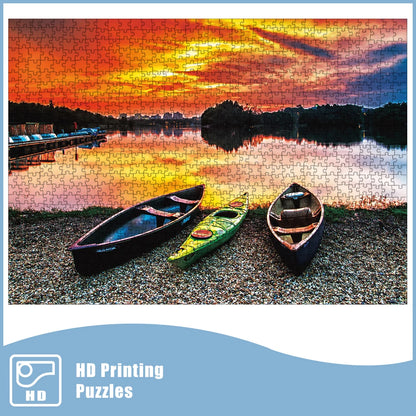 Assembled 1000-piece puzzle showing three kayaks by a lake beneath a colorful sunset