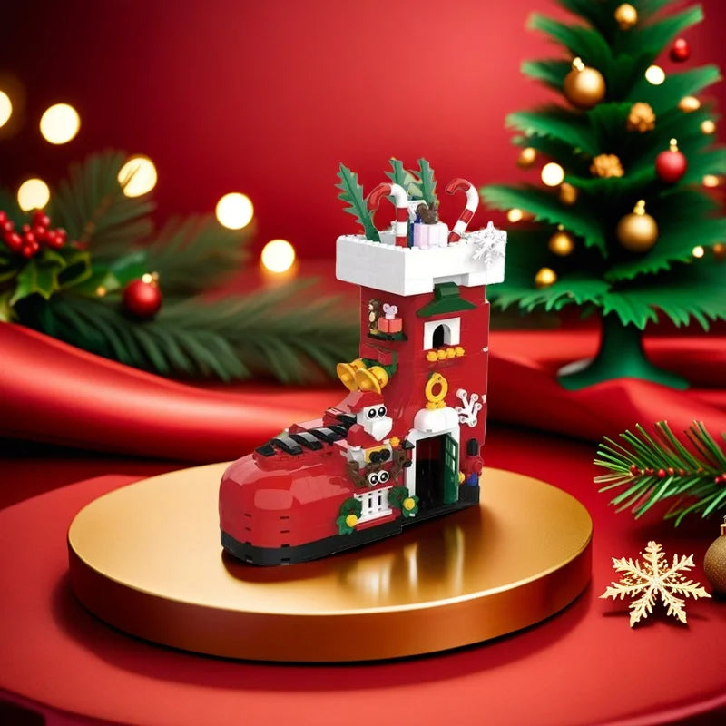 Red boot-shaped building set on round base with nutcracker and candy canes