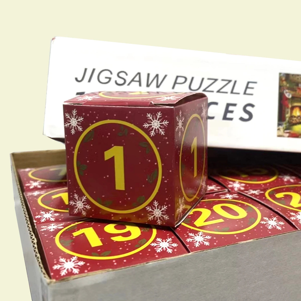 Christmas advent jigsaw puzzle display with stacked number 1 boxes and snowflakes