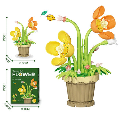 Yellow and orange flower pot building blocks with green stems in a tan pot