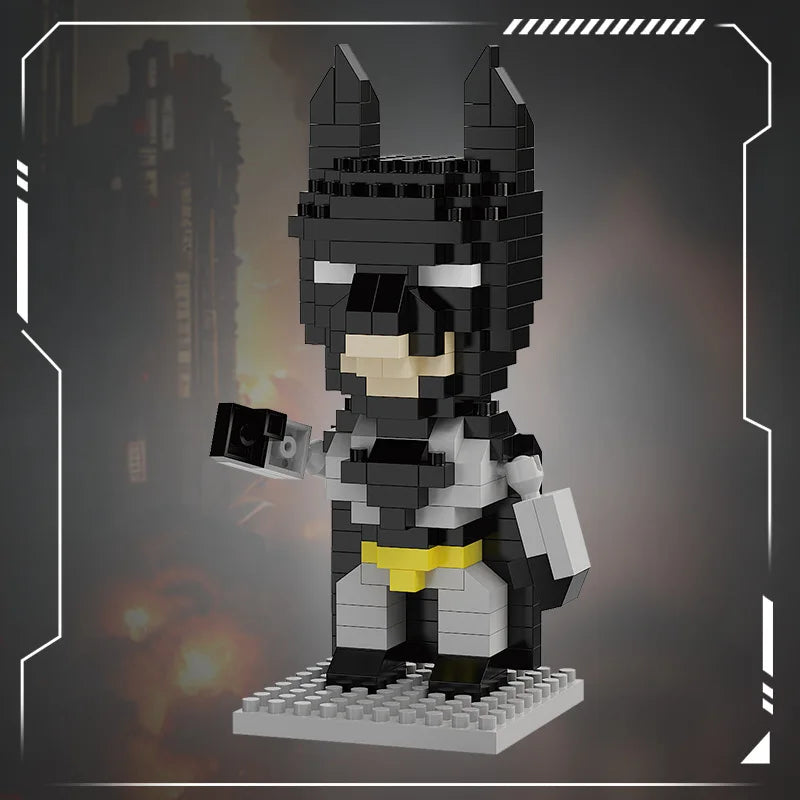 Mini brick hero figure in black and gray with yellow belt detail, holding a small gray brick